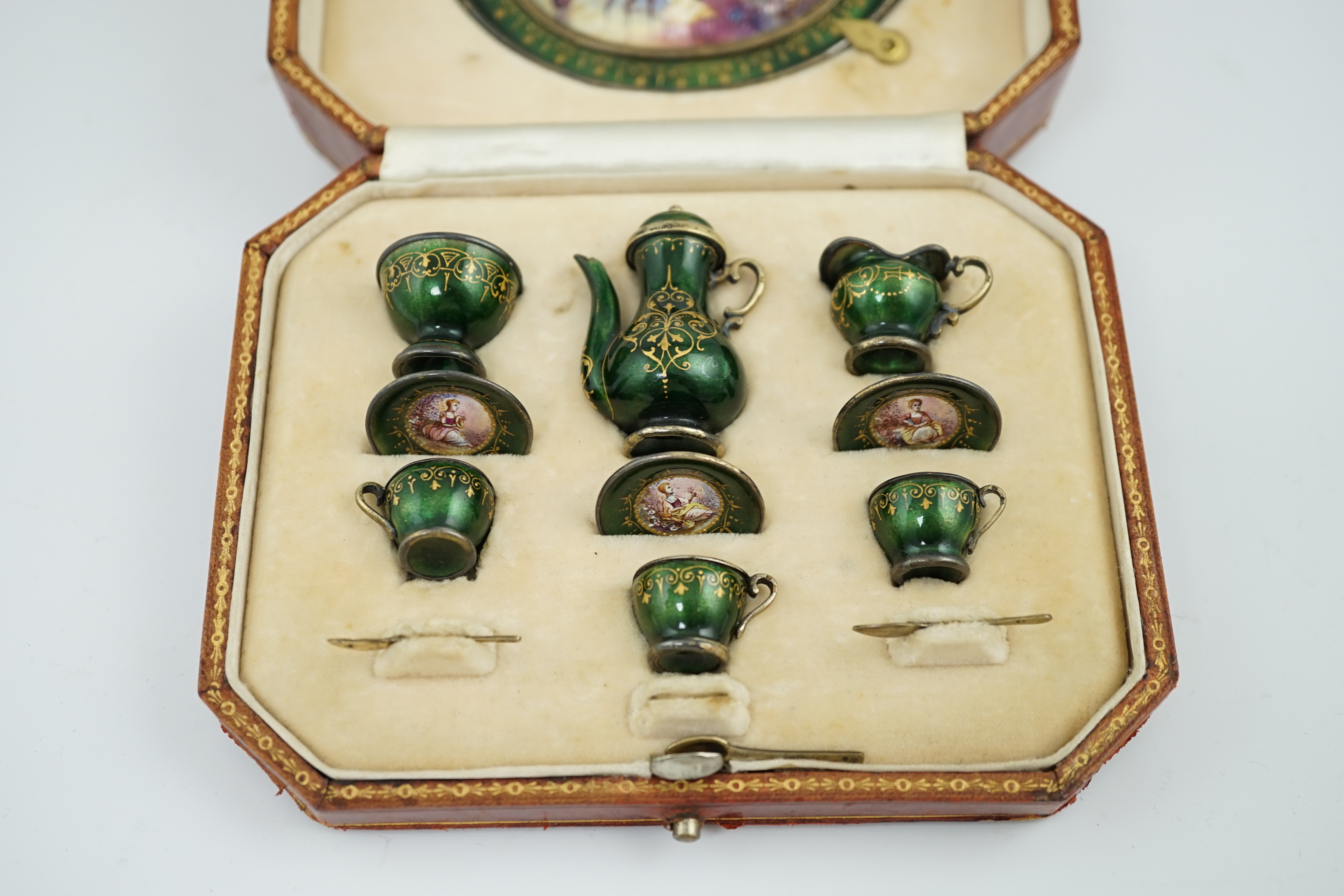 A cased late 19th century Viennese silver and polychrome enamelled miniature thirteen piece tea service, by Ludwig Politzer